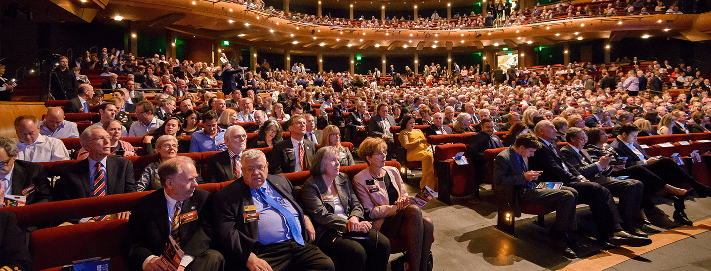 Auditorium full of people seated