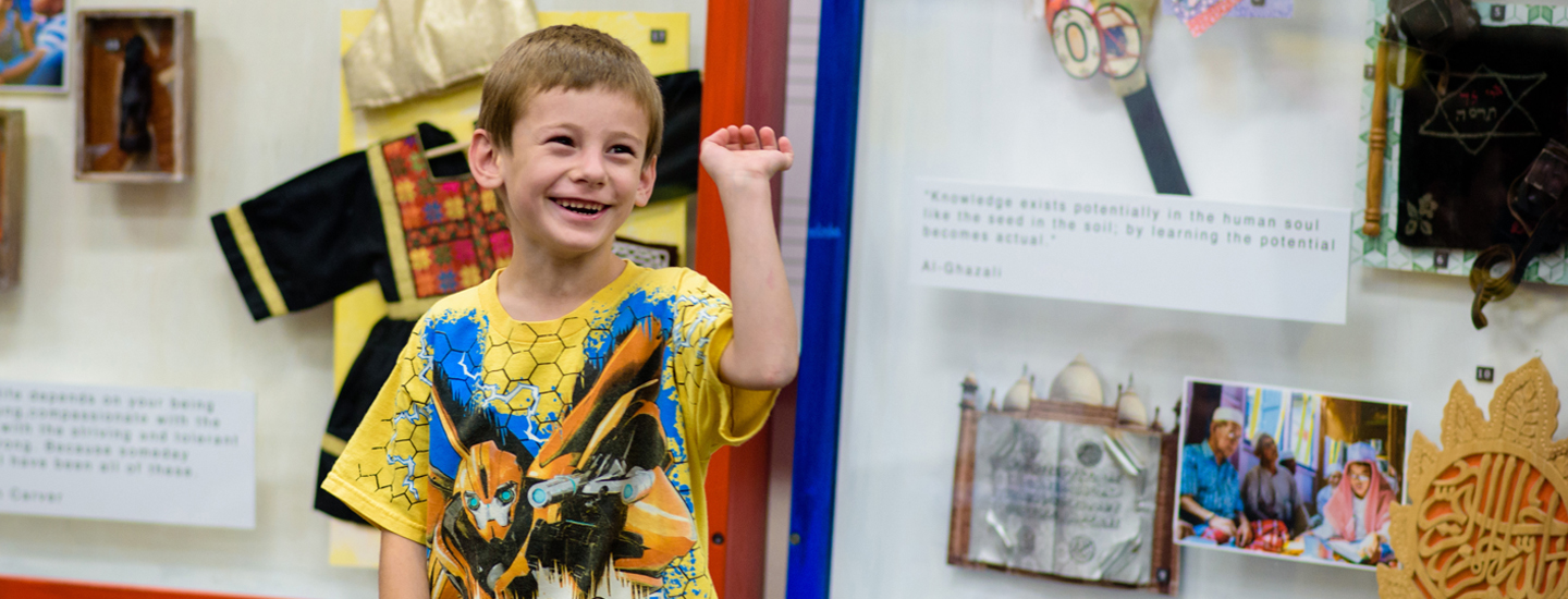 Child smiling in the Mizel Museum